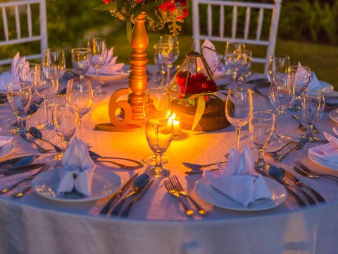 Candlelit tablescape with warm amber light from the CITTA heritage archive