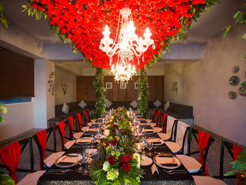 Dramatic red floral ceiling installation from the CITTA heritage archive